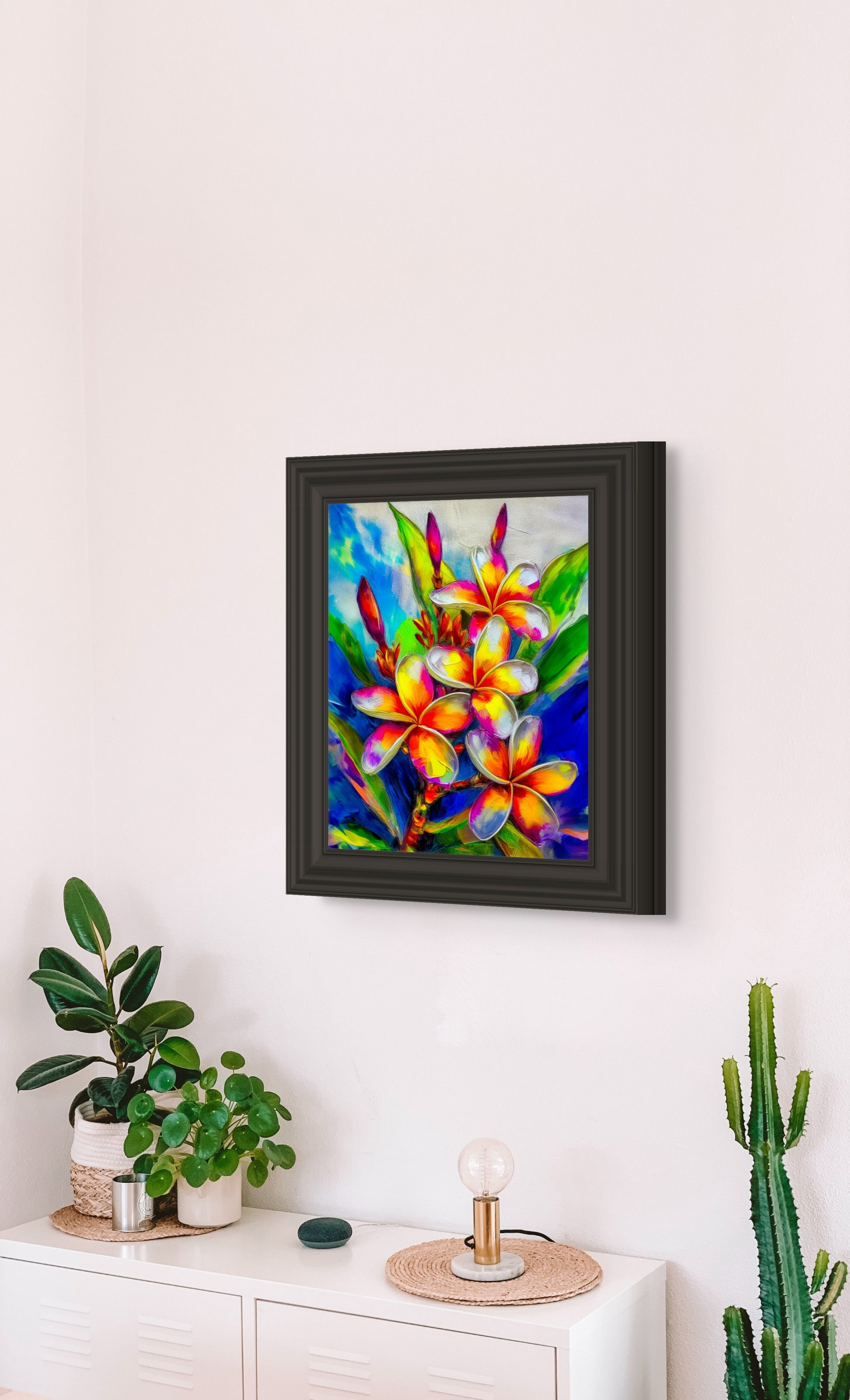 Framed canvas wall art of vibrant plumeria flowers with colorful tropical leaves image 1