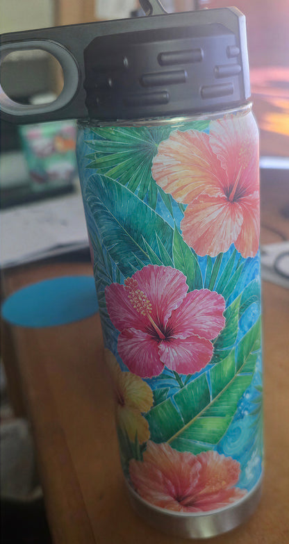 Front detail of the 20 oz bottle showing pink and coral hibiscus flowers, green leaves, turquoise background, and black lid.