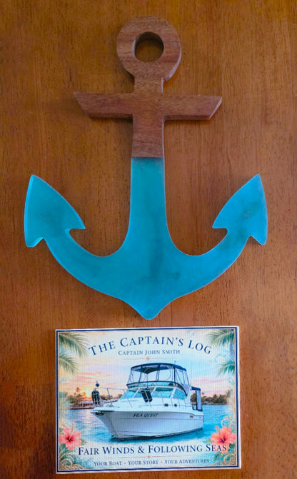 Finished personalized captain log wall hanging with mahogany and blue resin anchor above a custom boat canvas