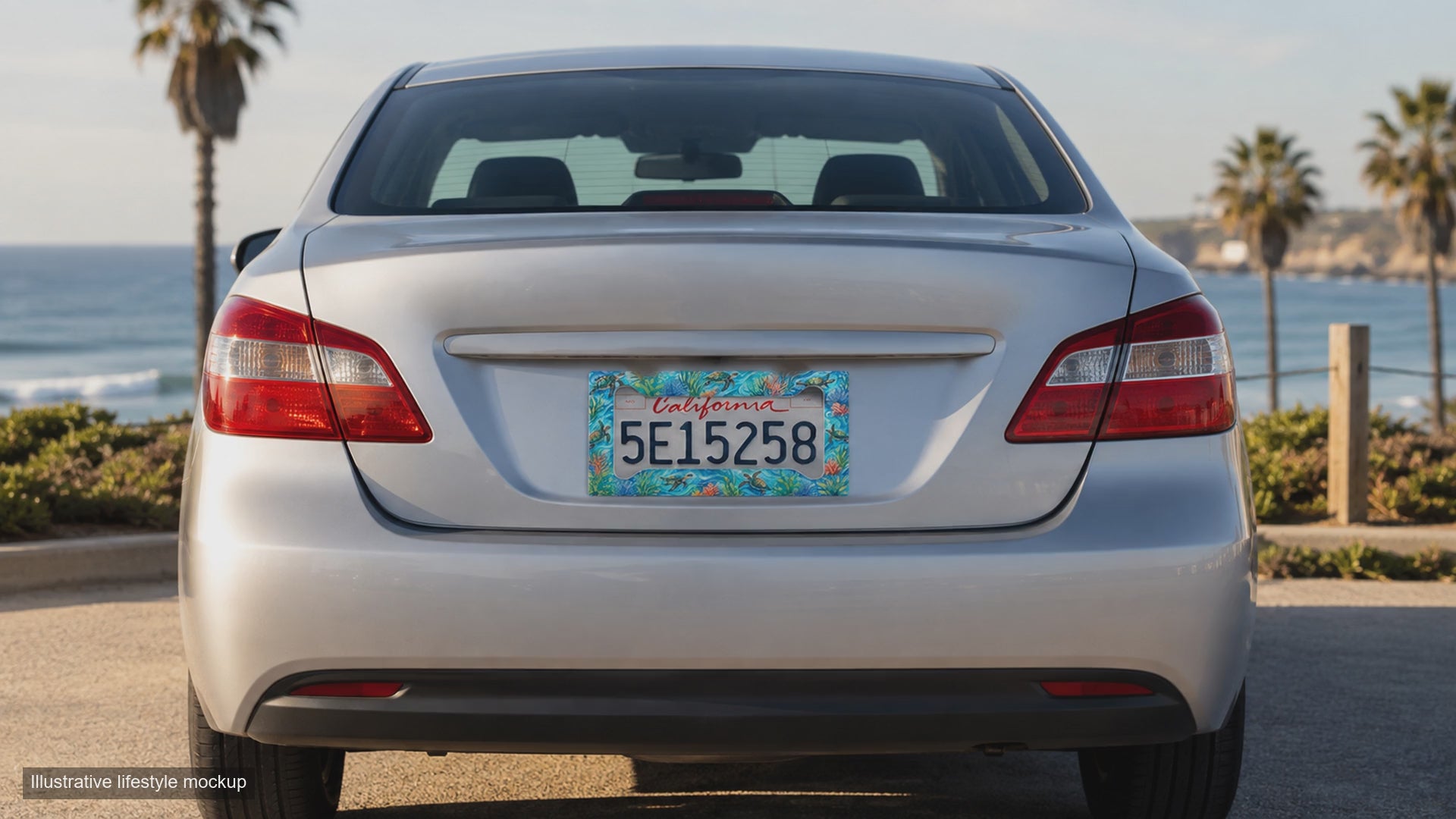 Ten-second illustrative lifestyle mockup showing the sea turtle coral reef license plate frame on a silver car at a coastal overlook.