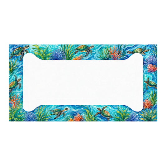 Aluminum license plate frame with green sea turtles, colorful coral and sea grass against turquoise water, shown in full on white.