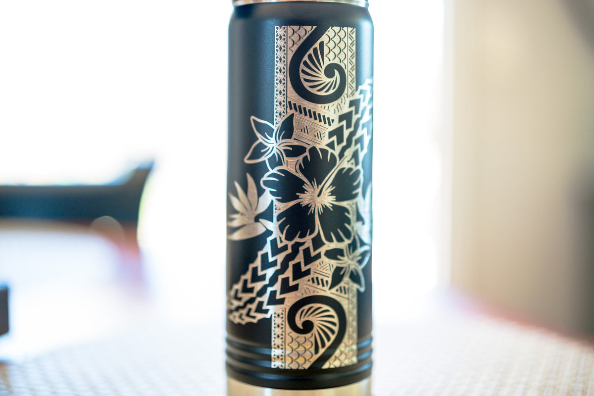 Black engraved hibiscus water bottle, silver tribal hibiscus engraving — detail close-up | Beach Hut Decor
